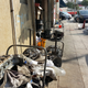 Some parts on the curb, just outside of a shop.